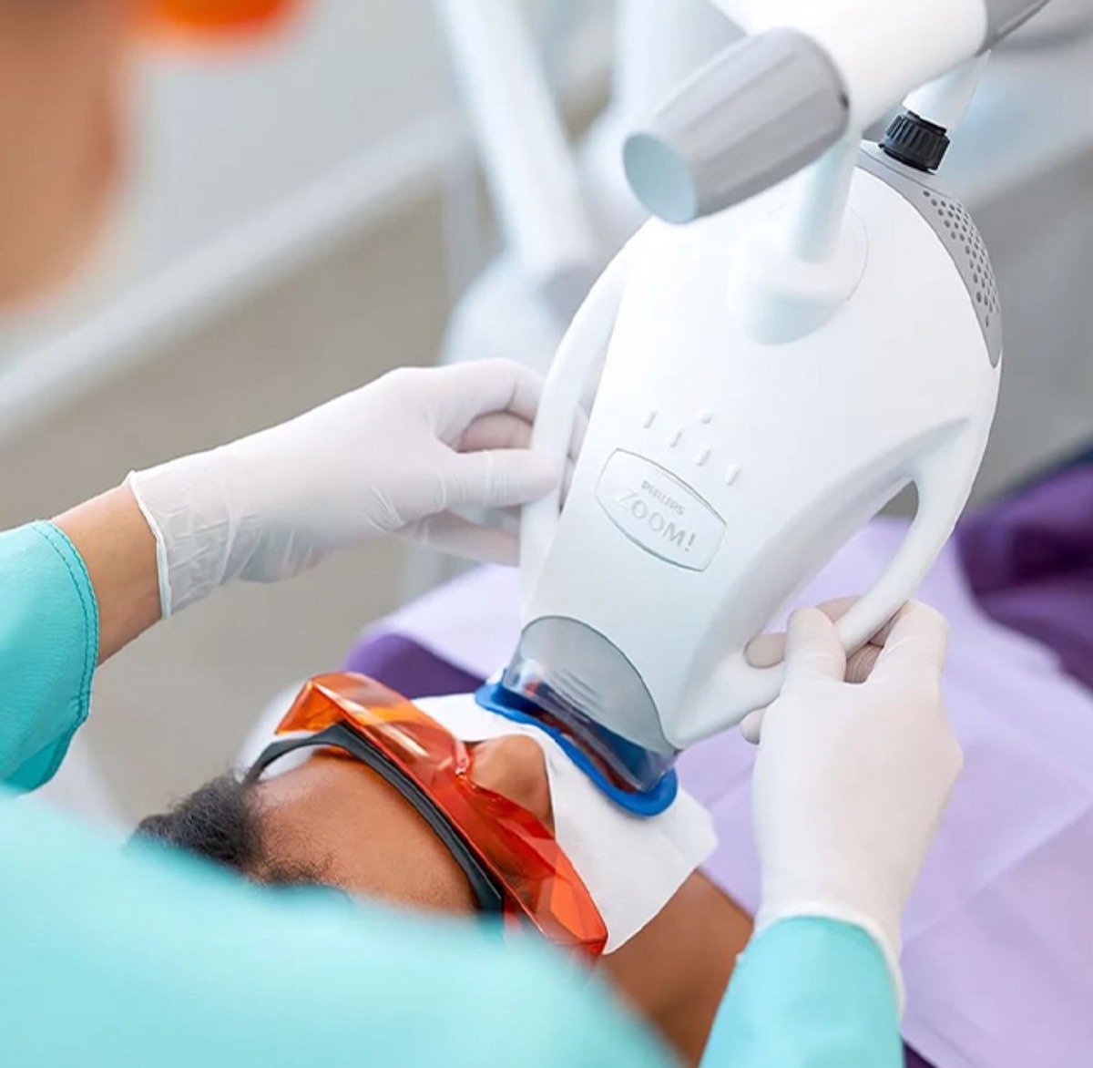 Laser teeth whitening device in use